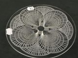 a glass plate with a circular design on it