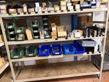 many boxes and bins on a shelf in a room