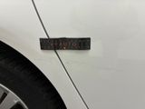 an image of a sticker on the side of a white car