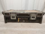 an old tool box is sitting on the floor with its lid open