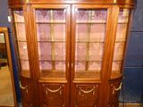 an image of a wooden display cabinet with glass doors