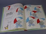 an open book with a picture of a cat and a dog in the rain