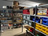 a room filled with shelves and bins of assorted items