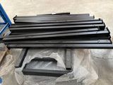 a close up of a pile of metal bars on a pallet