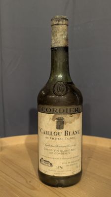 a bottle of wine that is sitting on a table