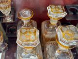 a lot of glass vases that are sitting on a table