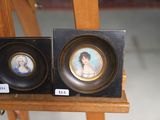 two framed pictures of a woman and a man on a easel