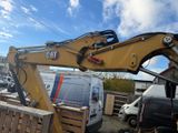 a large yellow machine that is sitting on the back of a truck