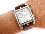 a close up of a wrist with a watch on it