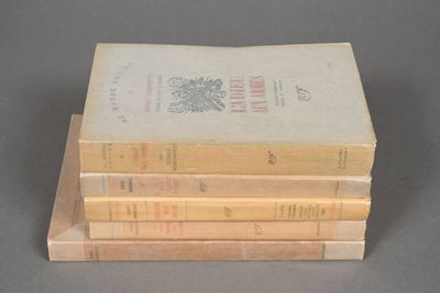 three books stacked on top of each other on a table