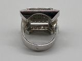 an image of a ring with a black stone in it