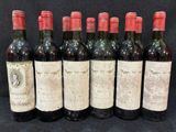 six bouteilles de vin sont alignées dans une rangée