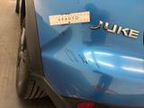 a sticker on the back of a blue car