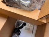 a box with a computer inside of it on a table