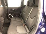 the back seats of a blue car are empty and the seats are empty