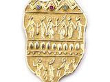 an image of a gold plate with a group of people on it