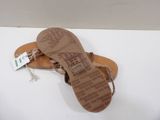 an image of a pair of sandals on a white surface