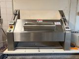 a machine that is sitting on a counter in a kitchen