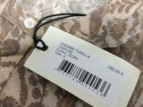 the label on the shirt is attached to the neck of the shirt