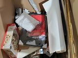 a cardboard box filled with assorted items in it