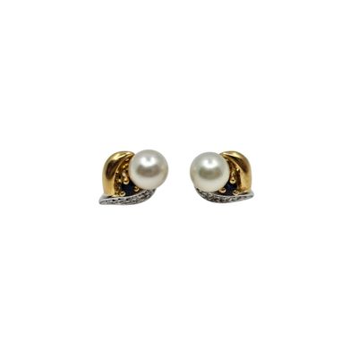 a pair of pearl and diamond earrings on a white background