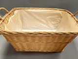 a wicker basket with a plastic liner inside of it