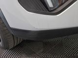 a close up of a car ' s front bumper with the door open