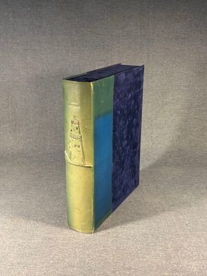 a blue and green book sitting on a table