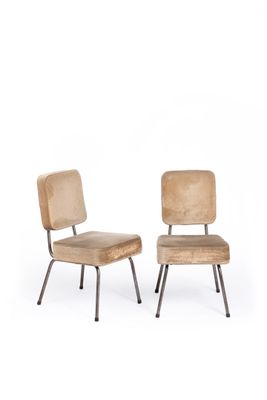 pair of chairs with upholstered backrests and metal legs