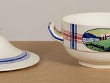 a small cup and saucer sitting on a table