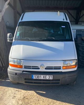 a white van that is parked in front of a building
