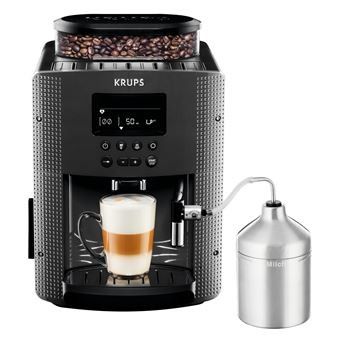 the krups coffee machine is next to a cup of coffee