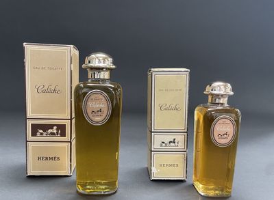 three bottles of perfume sitting next to each other on a table
