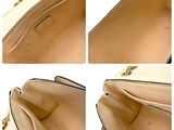 four different views of a purse with multiple compartments and a handle