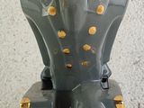 a figurine of a soldier sitting on a chair