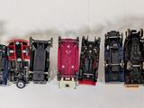 a lot of toy trains that are lined up on the wall