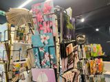a display of cards and umbrellas for sale in a store
