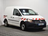 the white van is parked in a room with a checkered floor