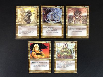 four cards of the card game are displayed on a black surface
