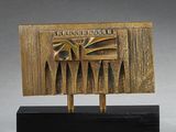 bronze sculpture of a building on a black base