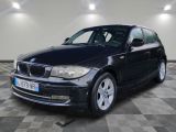 a picture of a black bmw car parked in a garage