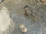 a close up of a metal pot with a lid
