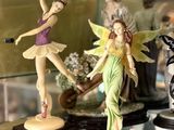 many figurines on display in a glass case