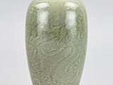 chinese celade vase with a dragon design on a green glazee glazee glazee glazee glazee glazee glaze