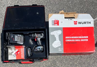 a box with a drill and a cordless drilldriver in it