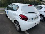 a white car parked in a parking lot next to other cars