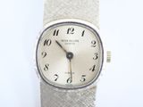 a close up of a wrist watch with a white dial