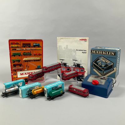 a lot of toy trains that are sitting on a table