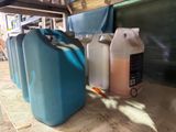 three plastic containers sitting next to each other on the ground