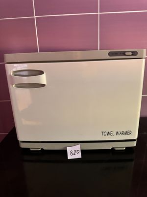 a small white oven sitting on a counter in a kitchen